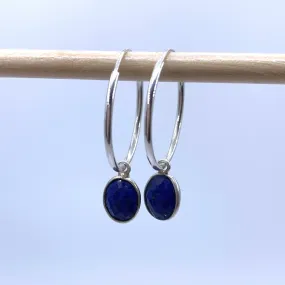 Gemstone earrings with lapis lazuli (blue) oval crystal drops on silver medium hoops